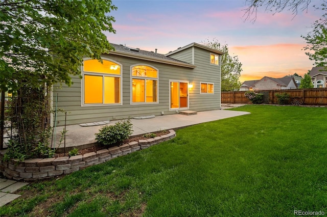 3371 Bexley Dr, Colorado Springs, CO 80922 - back of property at dusk featuring a patio