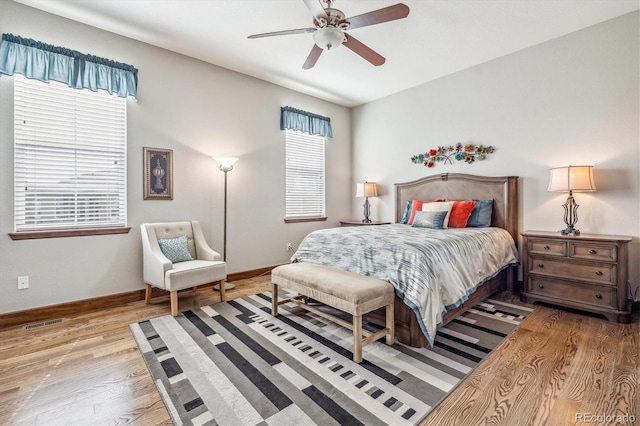 bedroom featuring light wood-type flooring and ceiling fan