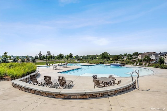 view of pool featuring a patio area