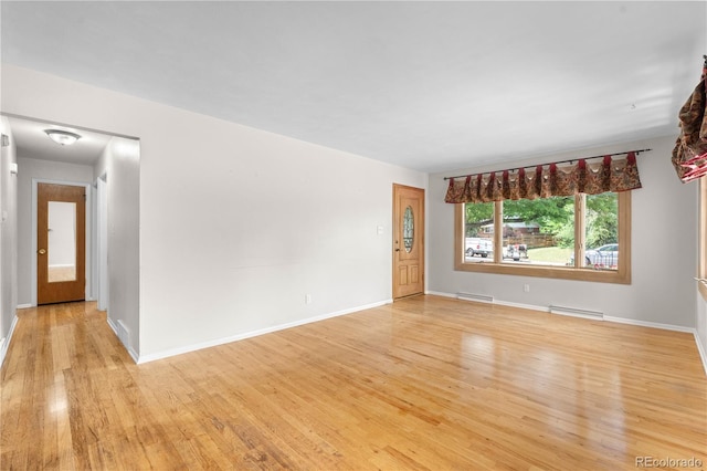 7742 W Florida Dr, Lakewood, CO 80232 - spare room with light wood-style flooring and baseboards