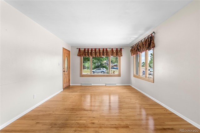 7742 W Florida Dr, Lakewood, CO 80232 - spare room featuring light wood finished floors and baseboards