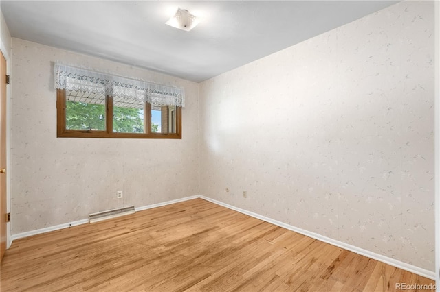 7742 W Florida Dr, Lakewood, CO 80232 - empty room featuring light wood-type flooring and baseboards