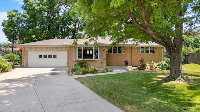 7742 W Florida Dr, Lakewood, CO 80232 - ranch-style house featuring a garage, brick siding, and driveway