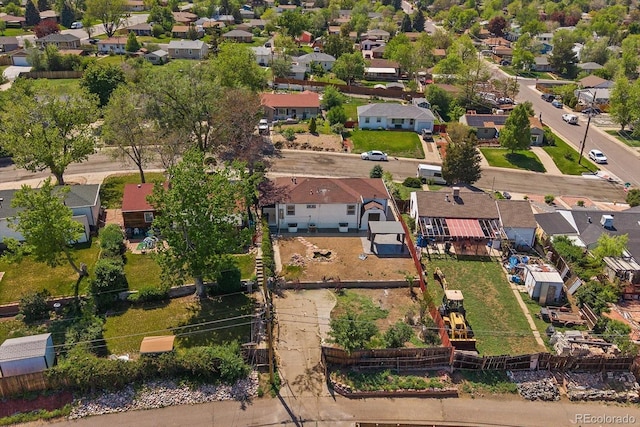 aerial view of property and surrounding area featuring nearby suburban area