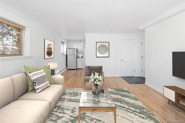 living room featuring light hardwood / wood-style flooring, plenty of natural light, and ornamental molding