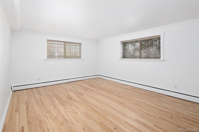 unfurnished room featuring light hardwood / wood-style flooring and ornamental molding