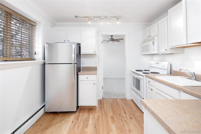 kitchen with ornamental molding, white appliances, ceiling fan, a baseboard radiator, and white cabinetry