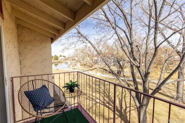 balcony featuring a water view