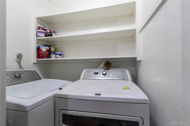 laundry area featuring laundry area and washer and clothes dryer