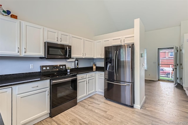 3734 Licorice Trl, Castle Rock, CO 80109 - kitchen with stainless steel appliances, white cabinets, dark countertops, and light wood-type flooring