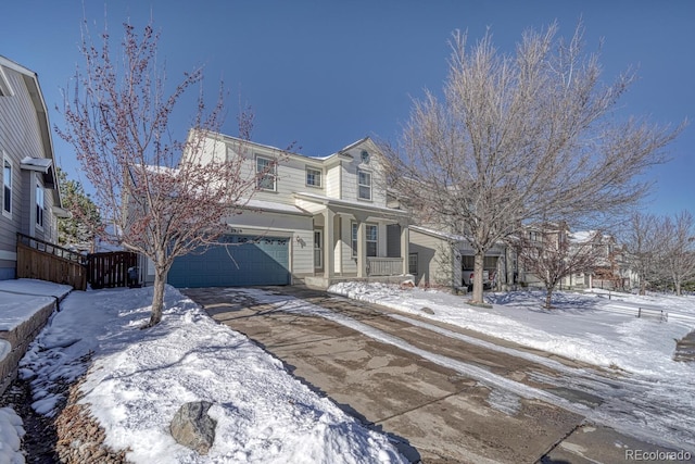 view of property featuring covered porch and a garage