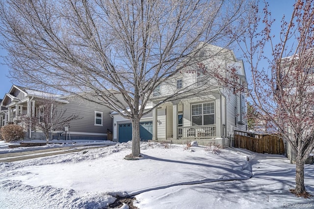 view of front of property with a porch and a garage