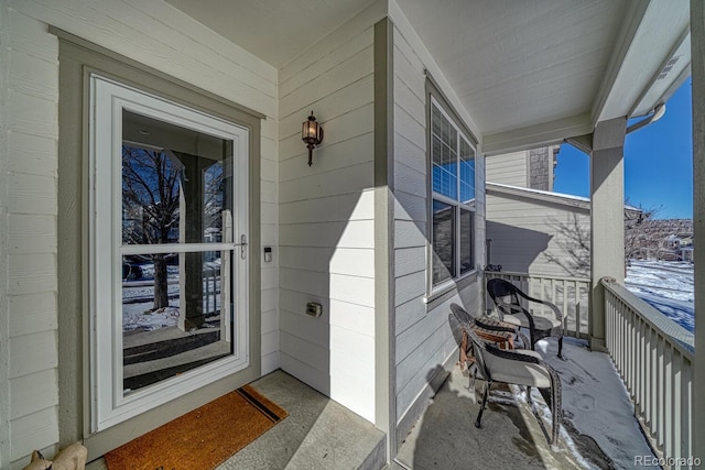 view of snow covered property entrance