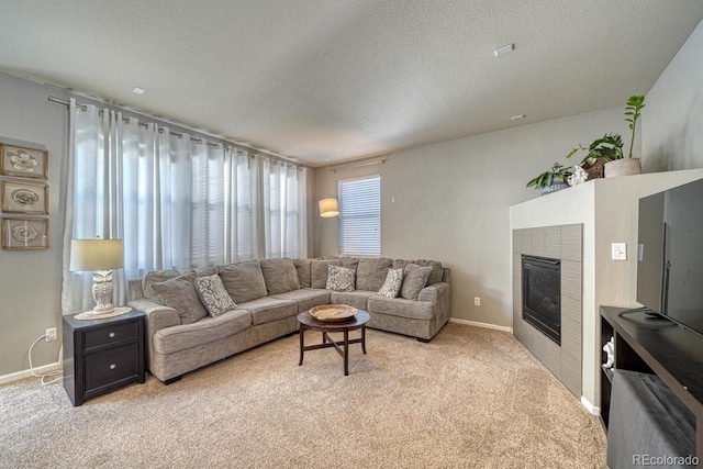 carpeted living room featuring a textured ceiling