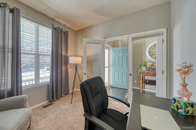 carpeted office space featuring french doors