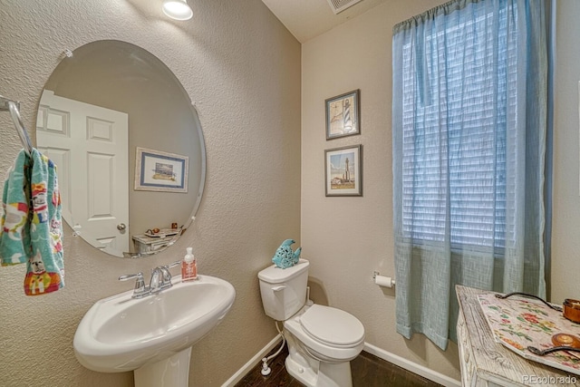 bathroom with sink and toilet