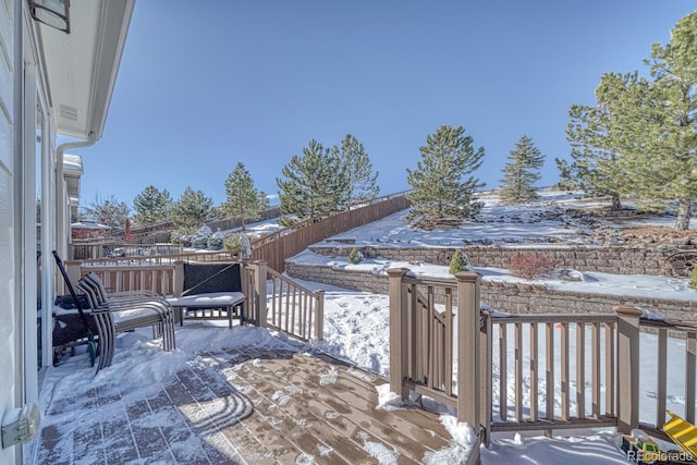 view of snow covered deck