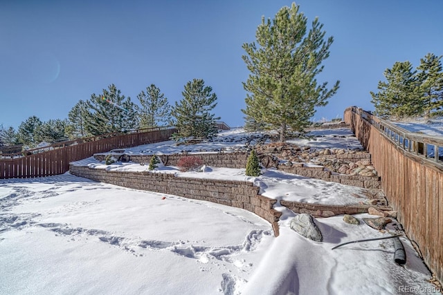 view of yard layered in snow