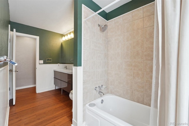 full bathroom with vanity, hardwood / wood-style floors, shower / bath combination with curtain, and toilet