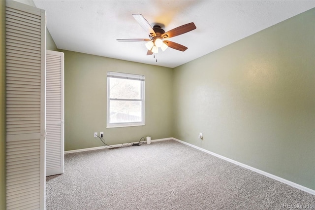 unfurnished room featuring carpet and ceiling fan