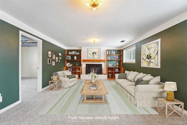 living room with carpet floors and built in features