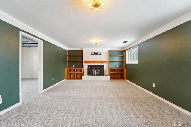 unfurnished living room featuring carpet flooring