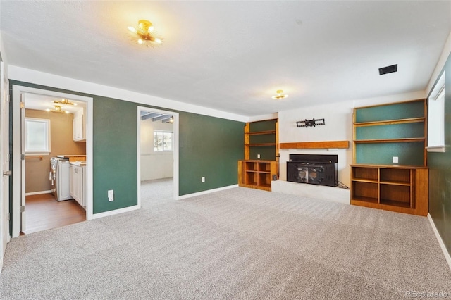 unfurnished living room with carpet flooring