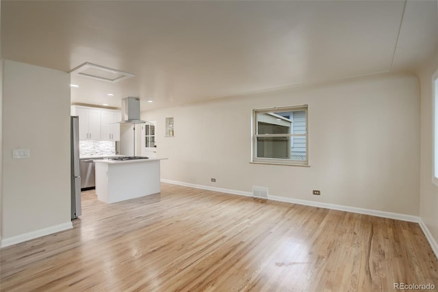 unfurnished living room with light wood-type flooring