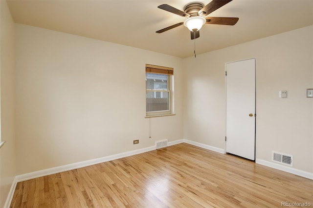 spare room with light hardwood / wood-style flooring and ceiling fan