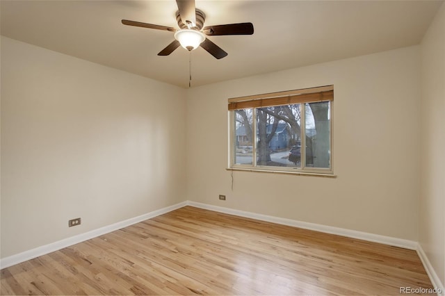 unfurnished room with ceiling fan and light wood-type flooring