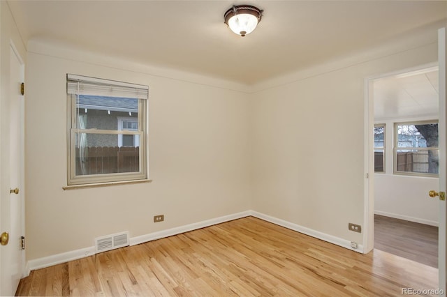 unfurnished room featuring light hardwood / wood-style floors