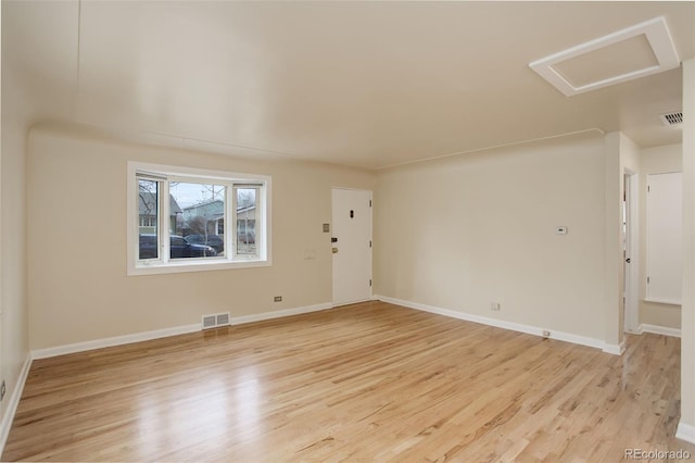 spare room featuring light hardwood / wood-style floors