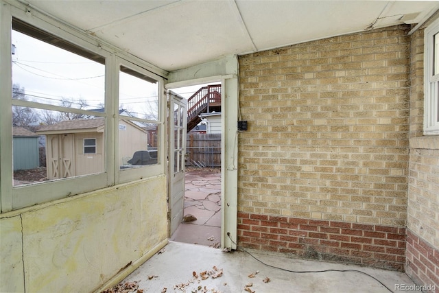 view of patio featuring a storage shed