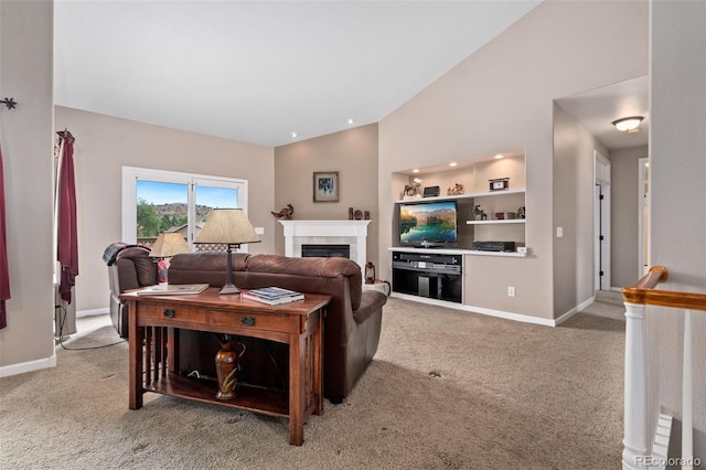 living room with lofted ceiling, light carpet, a fireplace, and baseboards