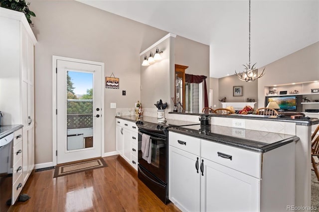 kitchen featuring black electric range, a peninsula, white cabinetry, and open floor plan