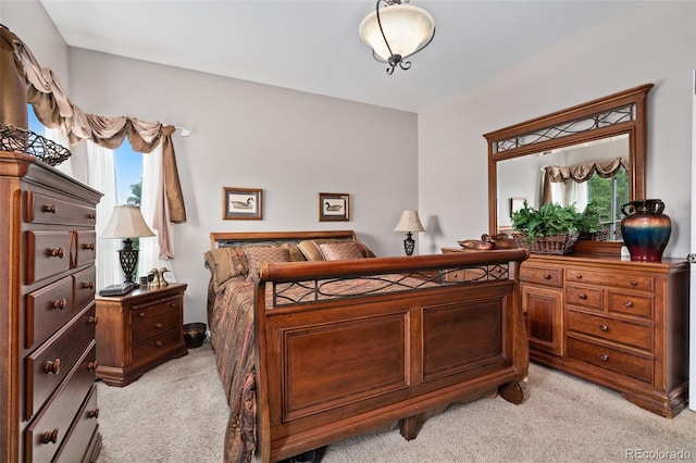 bedroom featuring light carpet