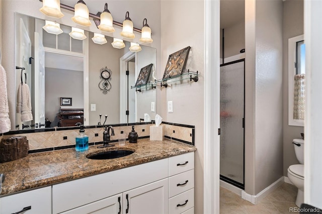 full bathroom with a stall shower, tasteful backsplash, toilet, tile patterned flooring, and vanity