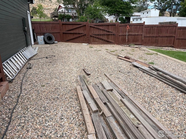 view of yard featuring a gate and fence