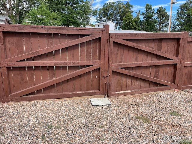 view of gate with fence