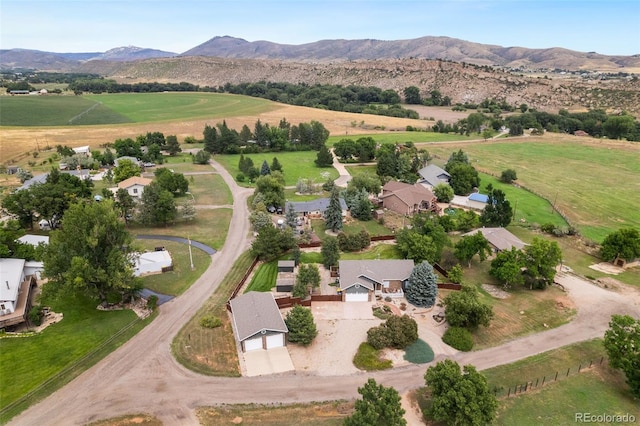 birds eye view of property featuring a mountain view