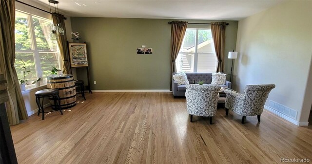 5049 Heatherglen Dr, Highlands Ranch, CO 80130 - living area featuring wood finished floors and baseboards