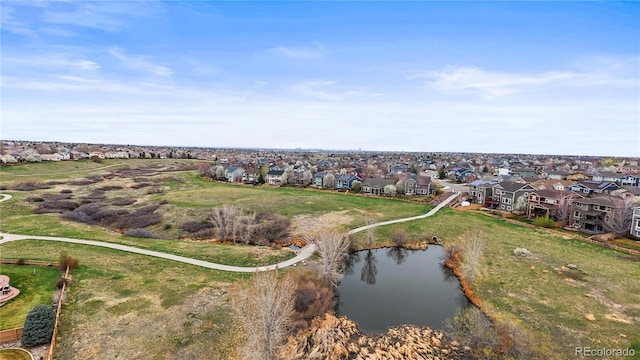 5049 Heatherglen Dr, Highlands Ranch, CO 80130 - aerial overview of property's location featuring nearby suburban area and a large body of water