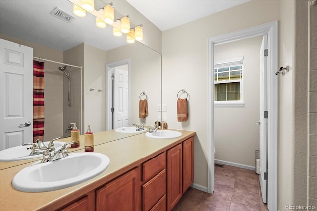 5049 Heatherglen Dr, Highlands Ranch, CO 80130 - full bathroom with double vanity, a shower with curtain, tile patterned floors, and baseboards