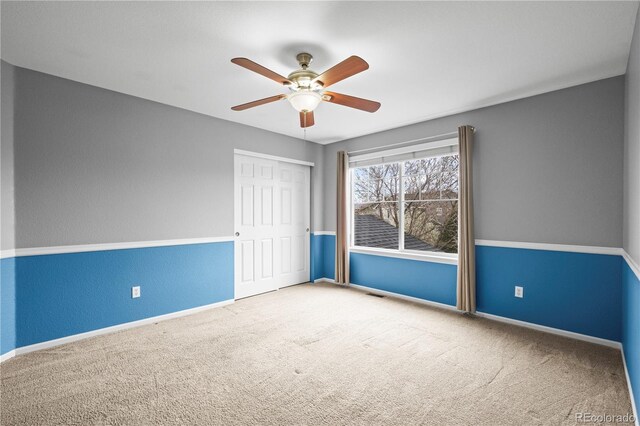5049 Heatherglen Dr, Highlands Ranch, CO 80130 - spare room with carpet floors, a ceiling fan, baseboards, and a textured wall