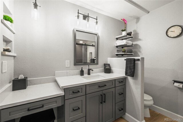 5049 Heatherglen Dr, Highlands Ranch, CO 80130 - full bath featuring toilet, vanity, and wood finished floors