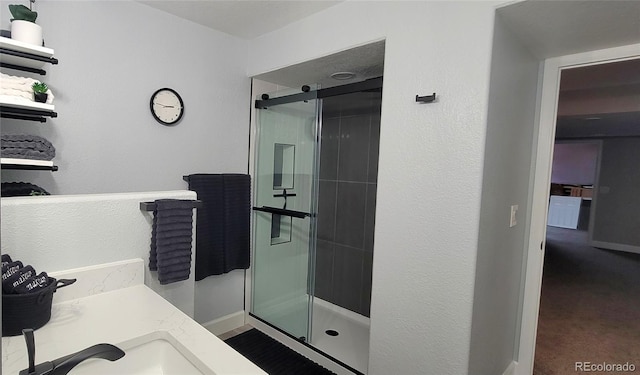 5049 Heatherglen Dr, Highlands Ranch, CO 80130 - full bath featuring a shower stall, vanity, and baseboards