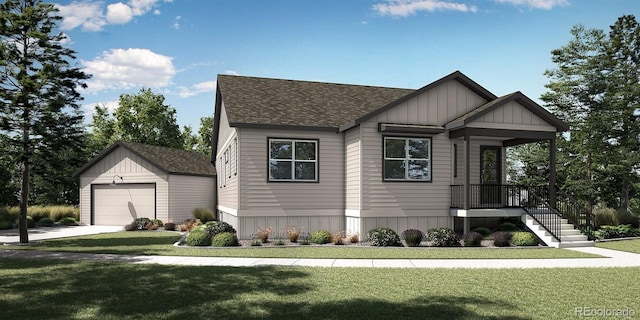 view of front of house with a garage, an outbuilding, and a front yard