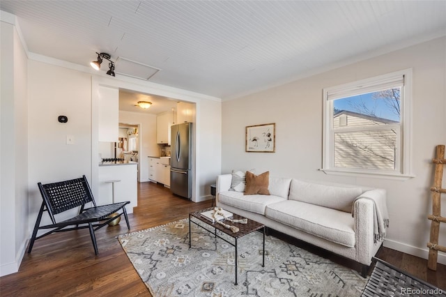 living area with dark wood finished floors and baseboards