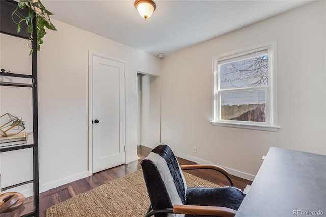 office area featuring baseboards and wood finished floors