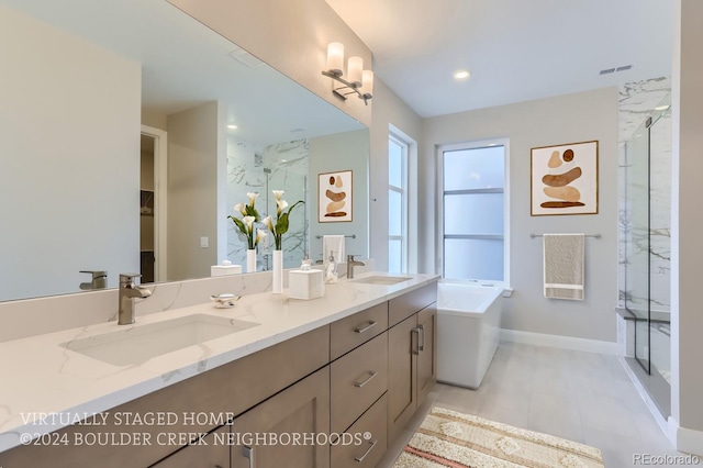 bathroom featuring vanity and separate shower and tub